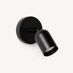 Adjustable spot LED Nordic wall light in black — a sleek directional wall spotlight for reading and task lighting.