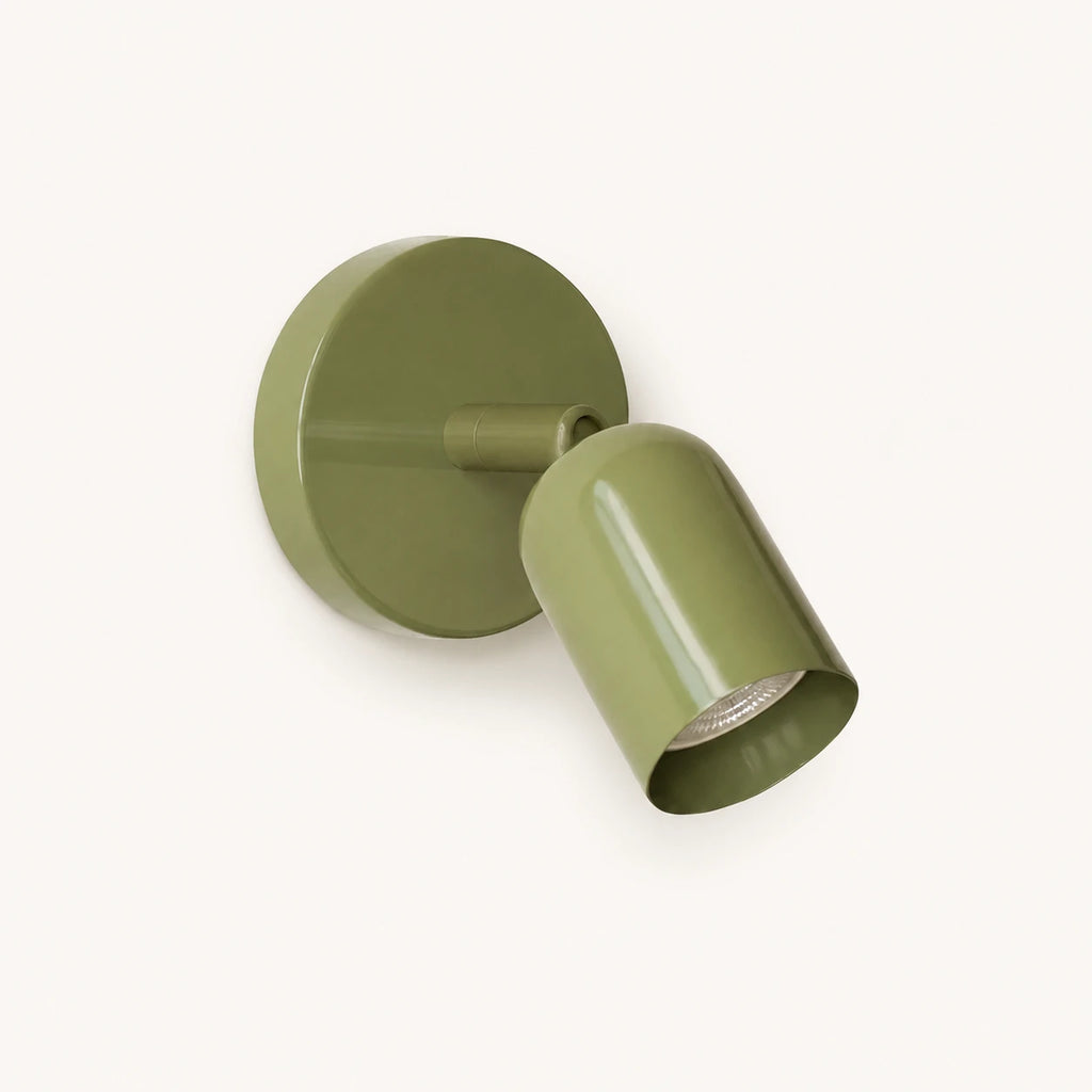 Adjustable spot LED Nordic wall light in sage green — a nature-inspired directional spotlight for Scandi and boho walls.