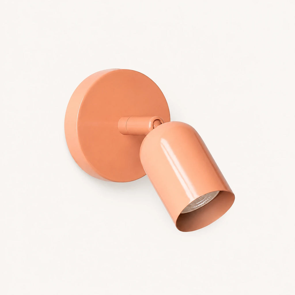 Adjustable spot LED Nordic wall light in pink — a playful pastel directional spotlight for bedroom and dressing room walls.