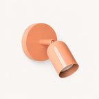 Adjustable spot LED Nordic wall light in pink — a playful pastel directional spotlight for bedroom and dressing room walls.