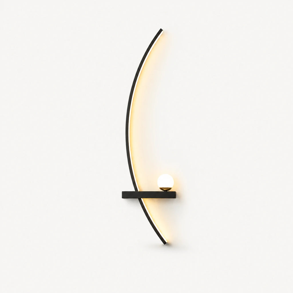 Black crescent arc LED bedside wall light in left-facing orientation — arc curves toward the centre of the bed.