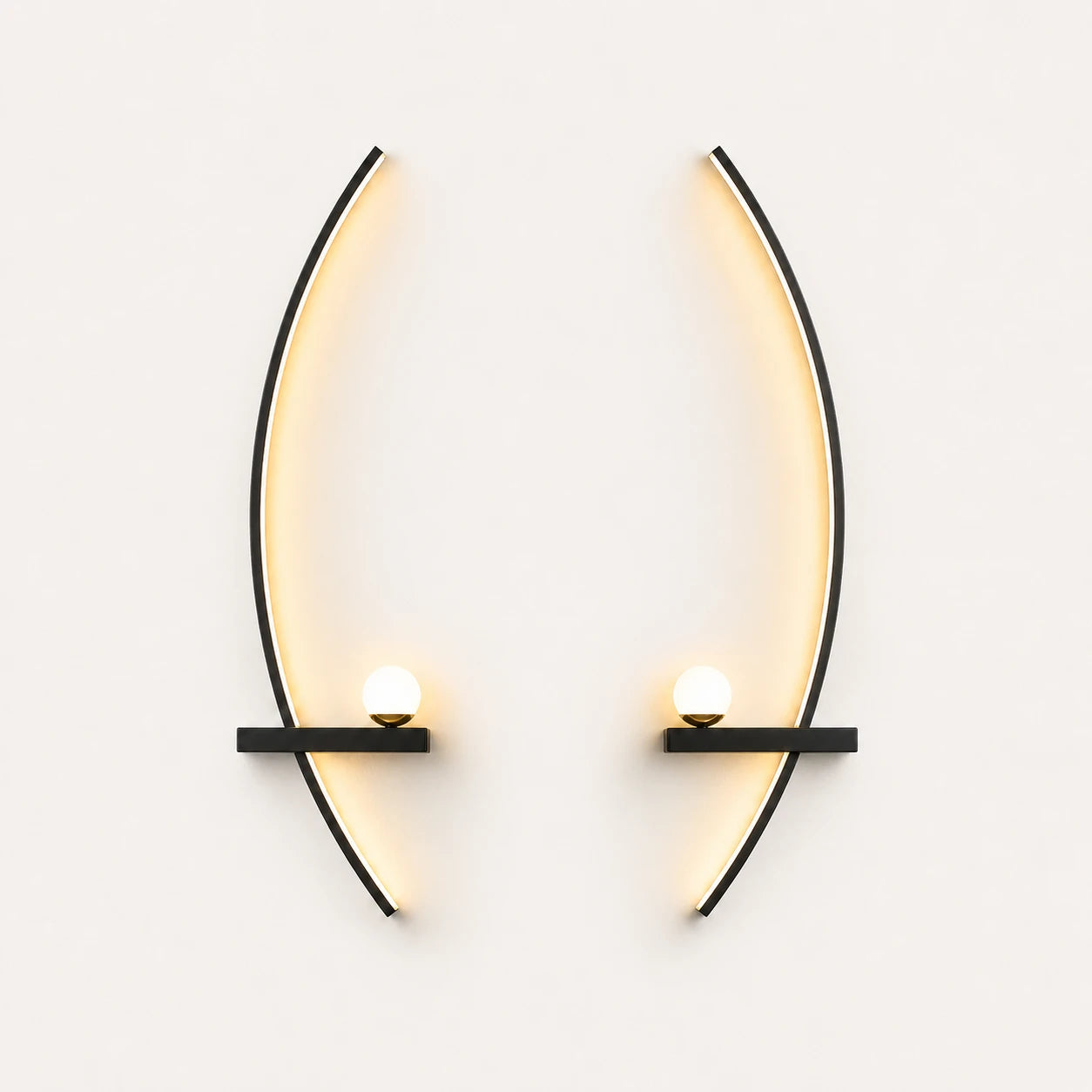 Black crescent arc LED bedside wall lights as a left and right pair for a double bed.