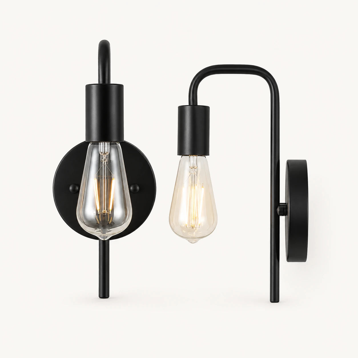 All-black bare bulb industrial wall sconce with matte black arm and socket holding Edison globe light bulb detail