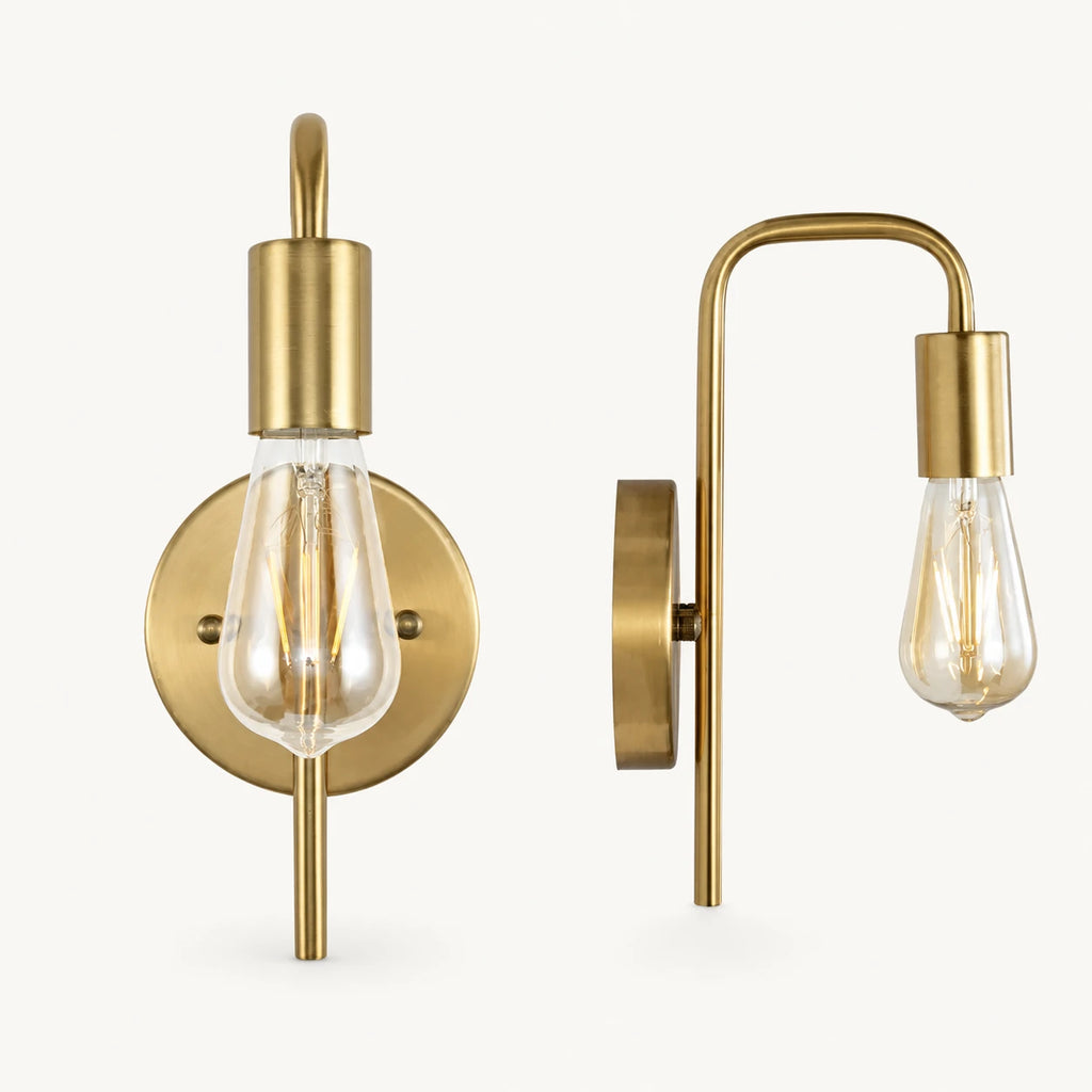 All-gold bare bulb industrial wall sconce with brushed gold arm and socket holding Edison globe light bulb detail