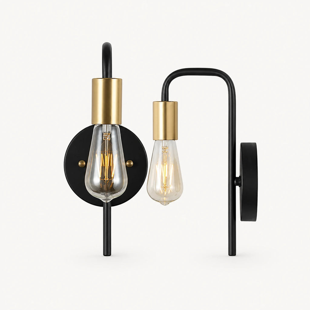 Black and gold bare bulb industrial wall sconce with black arm and gold socket holding Edison globe bulb detail
