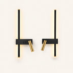 Black LED strip spotlight bedside wall lights as a left and right pair for a double bed.