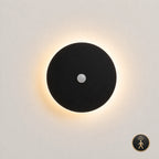 Black halo LED wall light 30cm with motion sensor — hands-free activation for hallways, staircases, and landing walls.