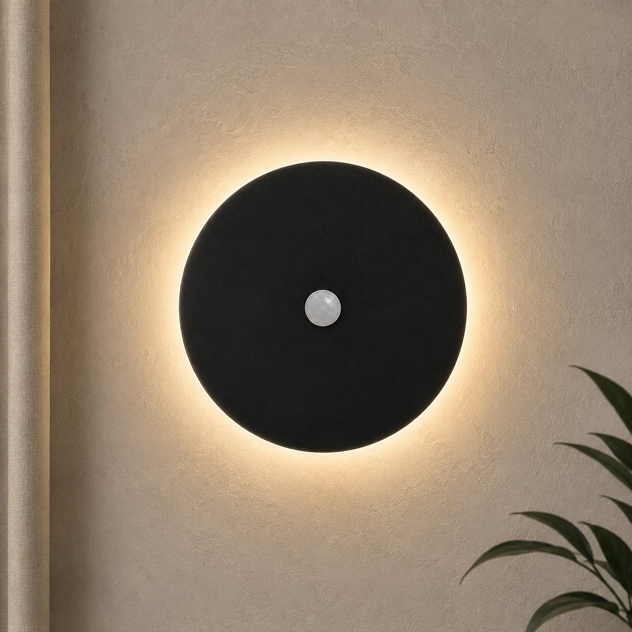 Black halo motion sensor LED modern wall light — black version with motion sensor activated.