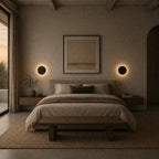 Black & White Halo Motion Sensor LED Modern Wall Lights in black flanking a bed in a rustic Nordic bedroom