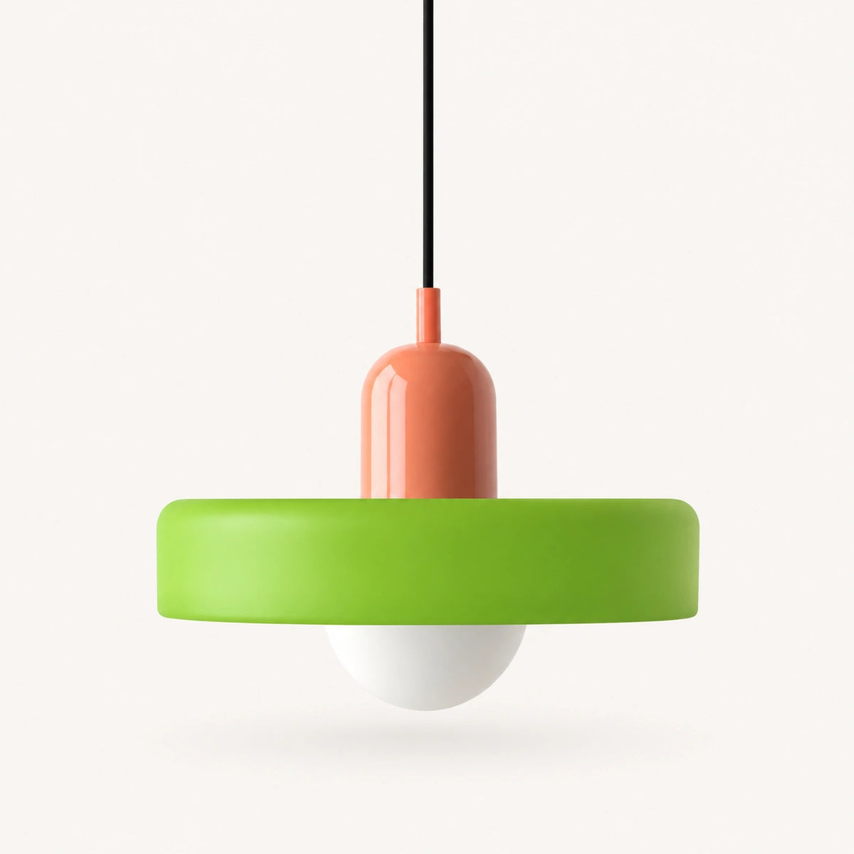 Coloured Glass Bauhaus Pendant Light shown in Green glass and Pink fitting, highlighting the compact pendant shape and finish.