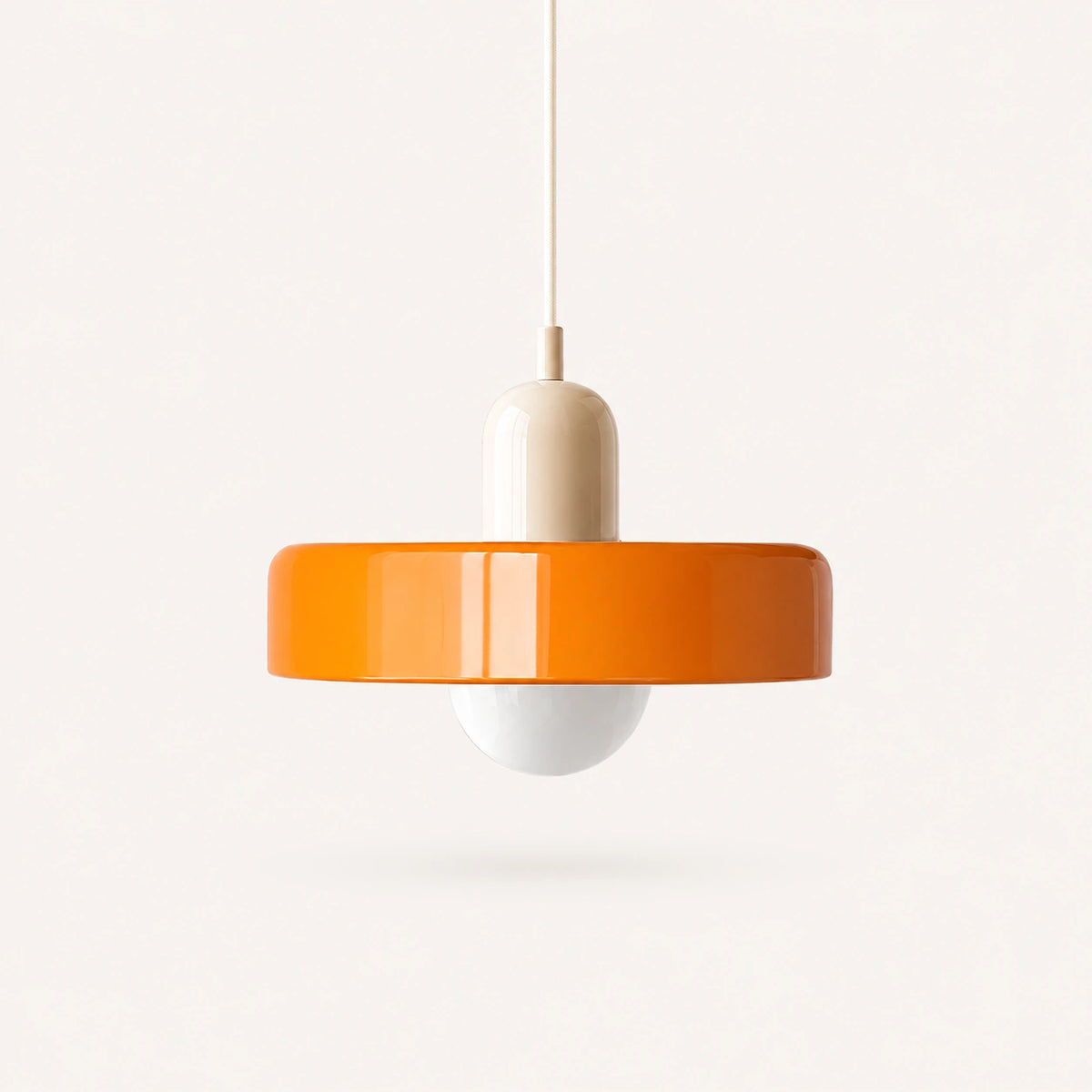 Coloured Glass Bauhaus Pendant Light shown in Orange glass and Beige fitting, highlighting the compact pendant shape and finish.