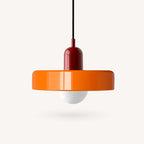 Coloured Glass Bauhaus Pendant Light shown in Orange glass and Red fitting, highlighting the compact pendant shape and finish.