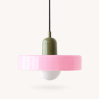 Coloured Glass Bauhaus Pendant Light shown in Pink glass and Green fitting, highlighting the compact pendant shape and finish.