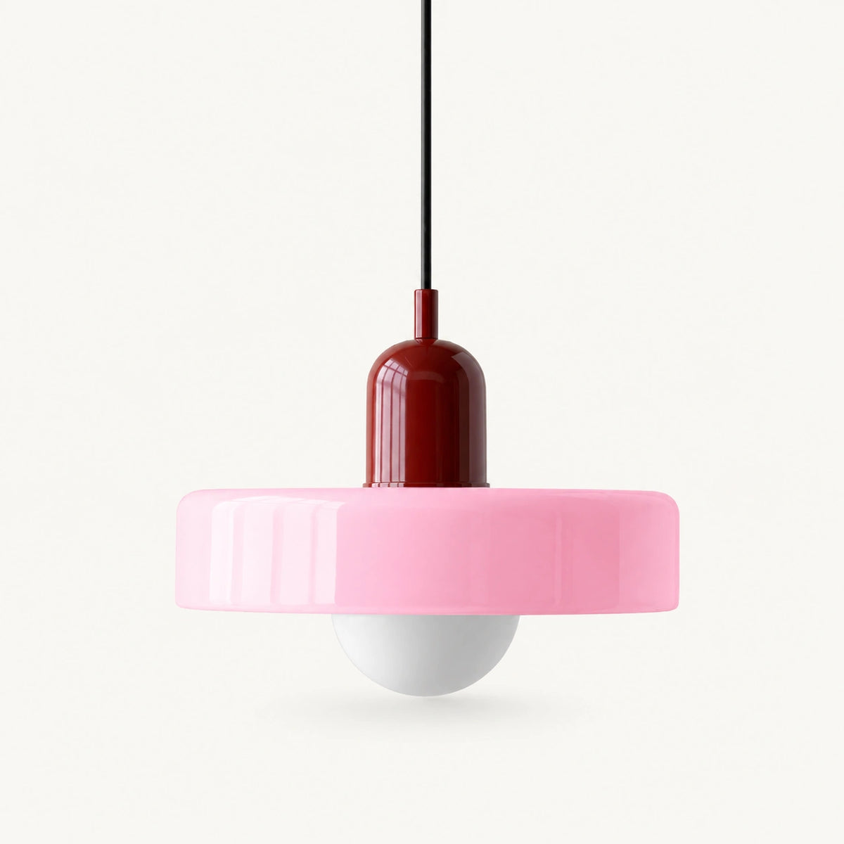 Coloured Glass Bauhaus Pendant Light shown in Pink glass and Red fitting, highlighting the compact pendant shape and finish.