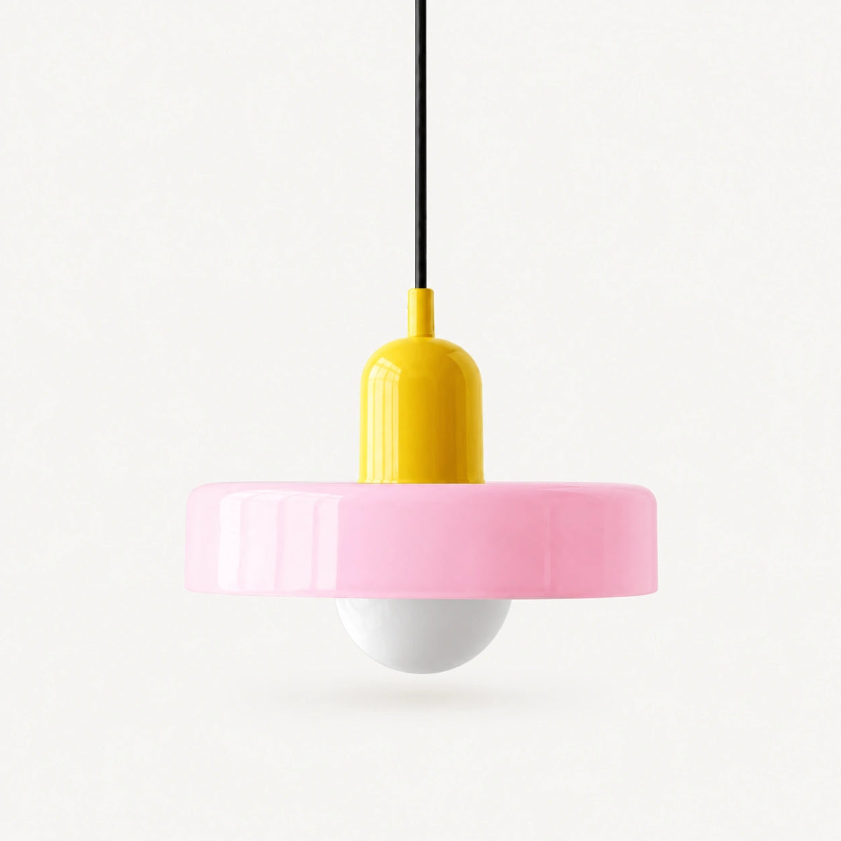 Coloured Glass Bauhaus Pendant Light shown in Pink glass and Yellow fitting, highlighting the compact pendant shape and finish.