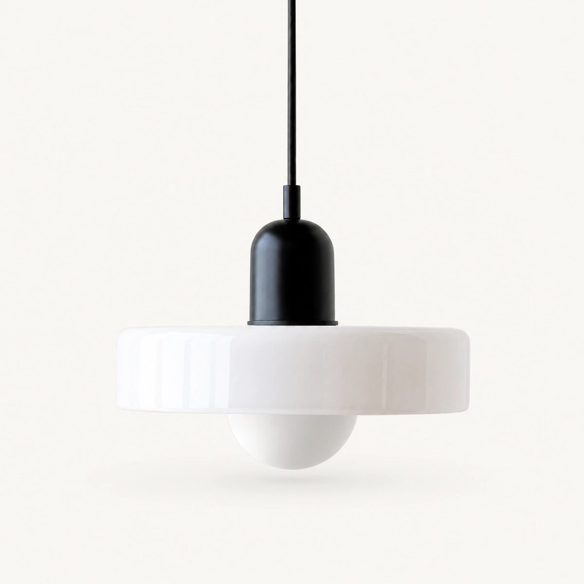 Coloured Glass Bauhaus Pendant Light shown in White glass and Black fitting, highlighting the compact pendant shape and finish.