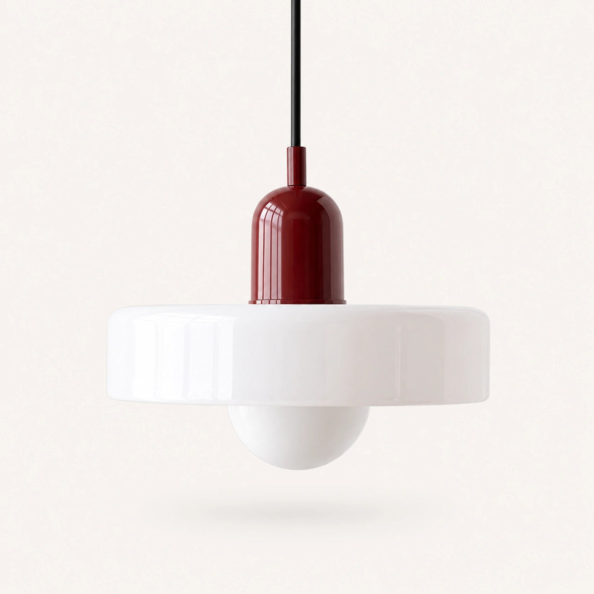 Coloured Glass Bauhaus Pendant Light shown in White glass and Red fitting, highlighting the compact pendant shape and finish.