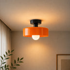 Coloured Glass Bauhaus Semi-Flush Ceiling Light in Orange glass with a Black fitting and bold geometric Bauhaus styling.