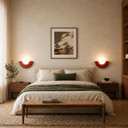 Pair of Colourful Glass Globe Nordic Wall Lights in terracotta red as bedside lights in a Nordic bedroom
