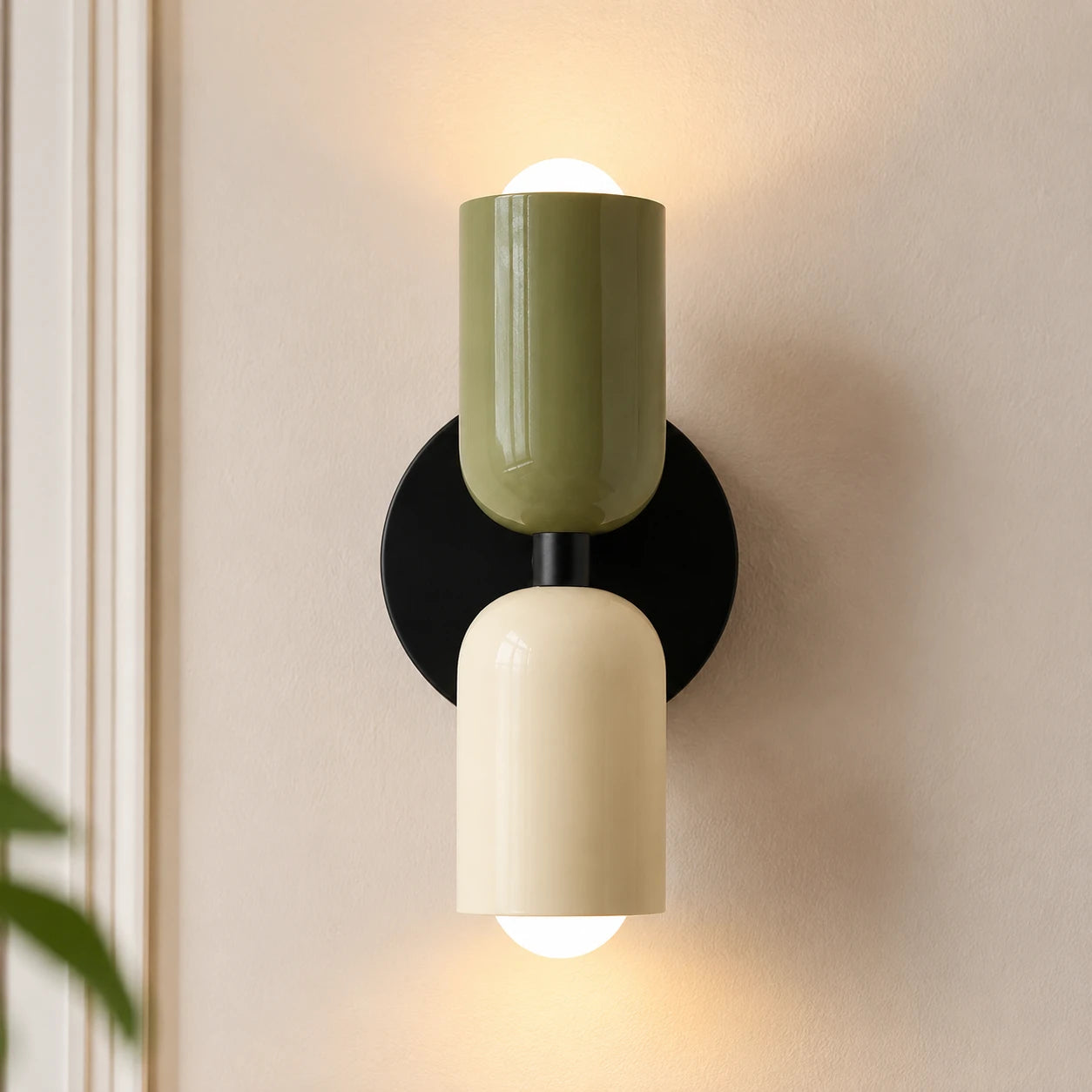 Colourful Nordic indoor wall light — green and white cylindrical shades on a black backplate for a bold two-tone look.