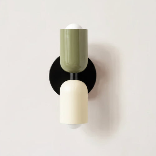 Colourful Nordic metal wall light with two cylindrical shades in green and white on a black base, casting light up and down