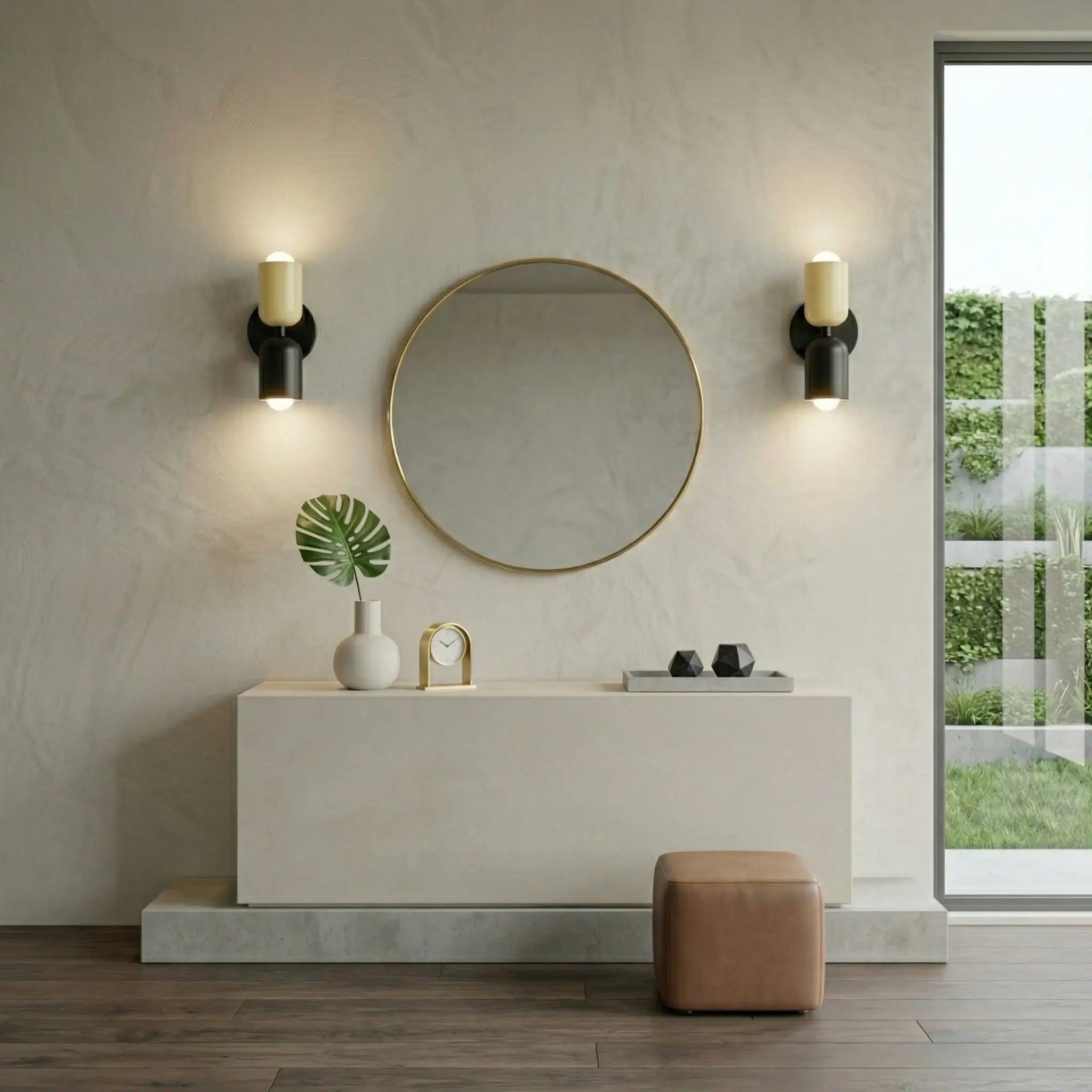 Pair of Nordic metal wall lights with cream cylindrical shades on black bases, mounted either side of a round mirror in a modern hallway