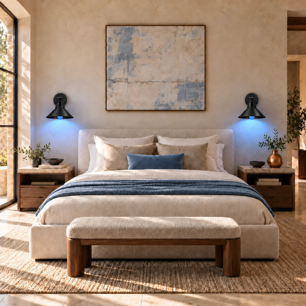 Black cone arm industrial wall sconce glowing in cool blue RGB mode, mounted beside a bed for ambient night lighting.