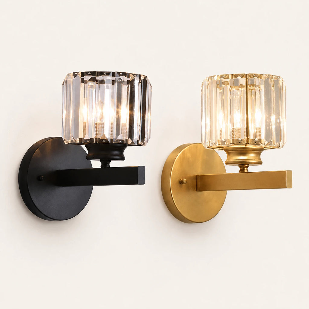 Crystal cylinder Art Deco wall sconce shown in black and gold hardware finish options with faceted crystal cylinder shade