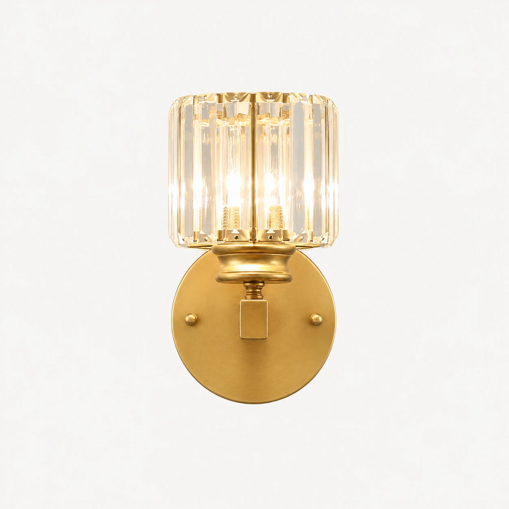 Gold crystal cylinder Art Deco wall sconce front view showing faceted crystal cylinder shade and brushed gold arm
