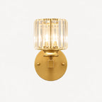 Gold crystal cylinder Art Deco wall sconce front view showing faceted crystal cylinder shade and brushed gold arm