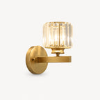 Gold crystal cylinder Art Deco wall sconce with brushed gold arm and faceted crystal cylinder shade product detail view