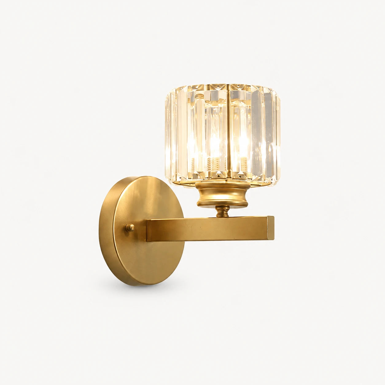 Gold crystal cylinder Art Deco wall sconce with brushed gold arm and faceted crystal cylinder shade product detail view