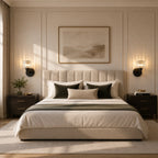 Black crystal cylinder Art Deco wall sconces as bedside reading lights flanking artwork in luxurious neutral bedroom