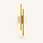 Double strip LED modern wall light in gold left-facing orientation — warm gold LED bars for left-side bedside placement.
