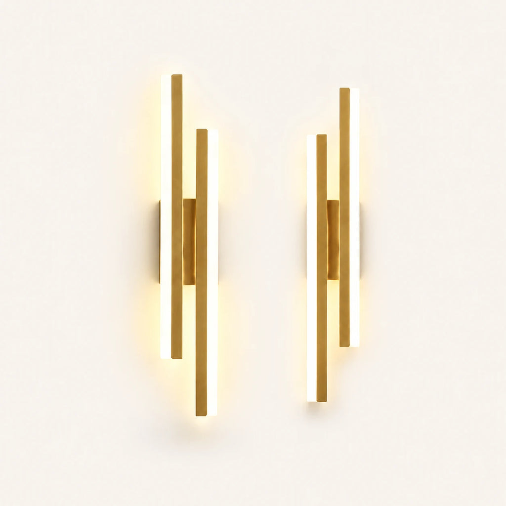 Double strip LED modern wall light in gold as a matched left and right pair for a double bed.