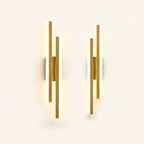 Double strip LED modern wall light in gold as a matched left and right pair for a double bed.