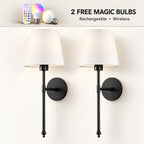 Pair of black fabric mid-century wireless wall sconces sold as a two-piece set with tapered fabric shades and brass stems.