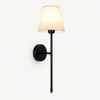 Black fabric mid-century wireless wall sconce in a single pack, featuring a tapered fabric shade on a brass-finished stem.