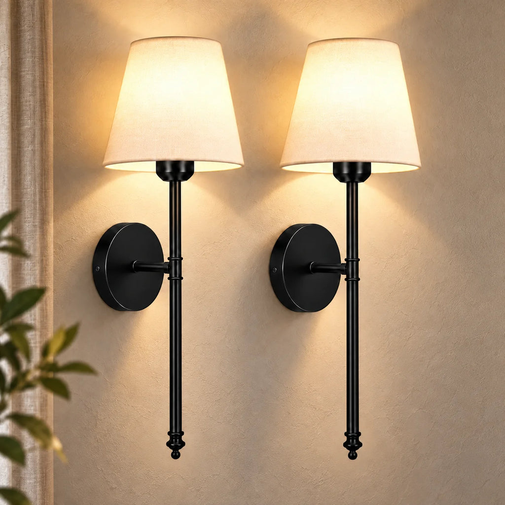 Pair of black fabric mid-century wireless wall sconces mounted together, each with a tapered fabric shade on a slim stem.