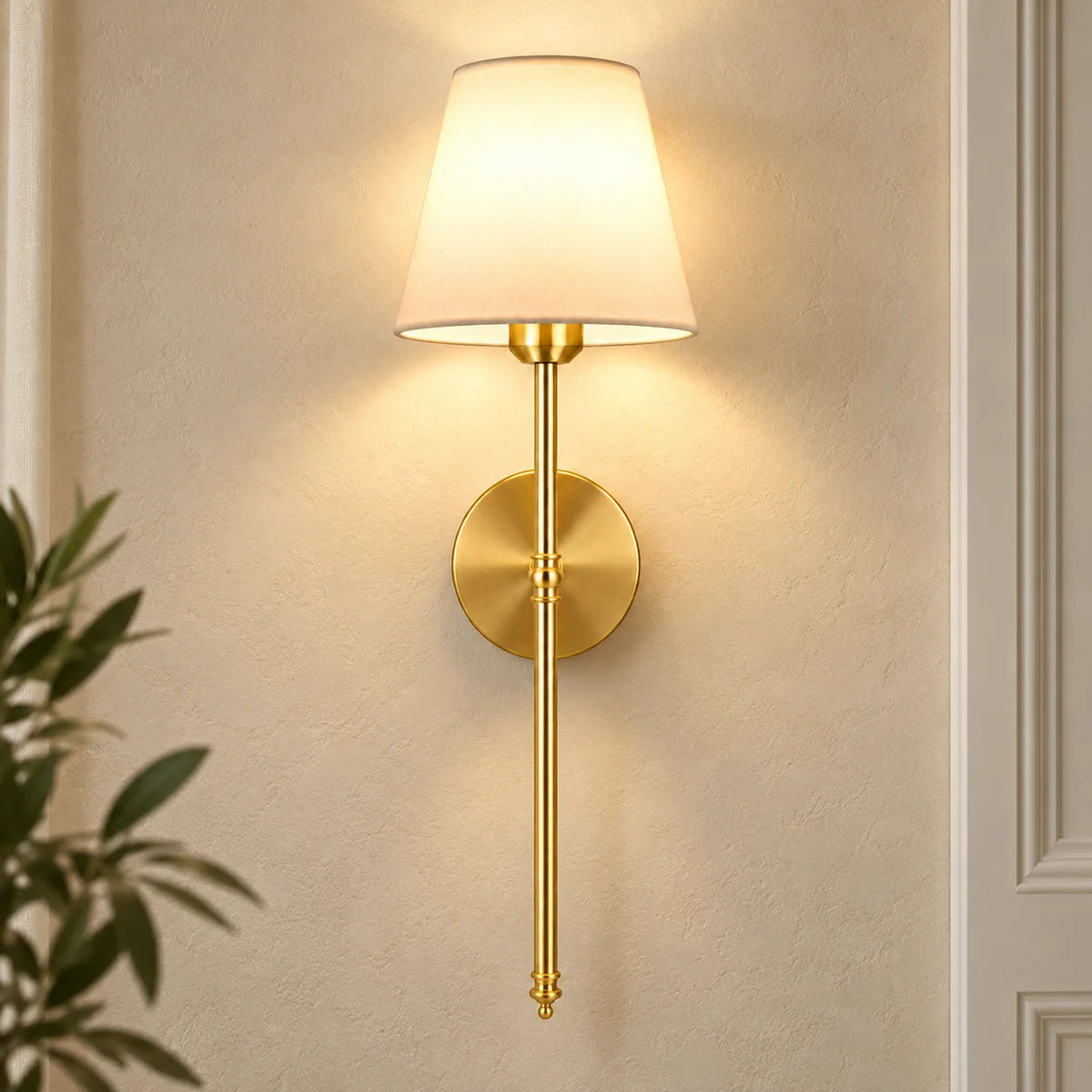 Gold fabric mid-century wireless wall sconce mounted on the wall, featuring a tapered fabric shade on a slim metal stem.