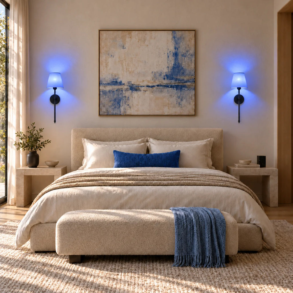 Black fabric mid-century wireless wall sconce glowing warmly in a bedroom, demonstrating its soft dimmable light at dusk.