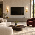 Gold fabric mid-century wireless wall sconce mounted in a living room, casting a warm ambient glow from its fabric shade.