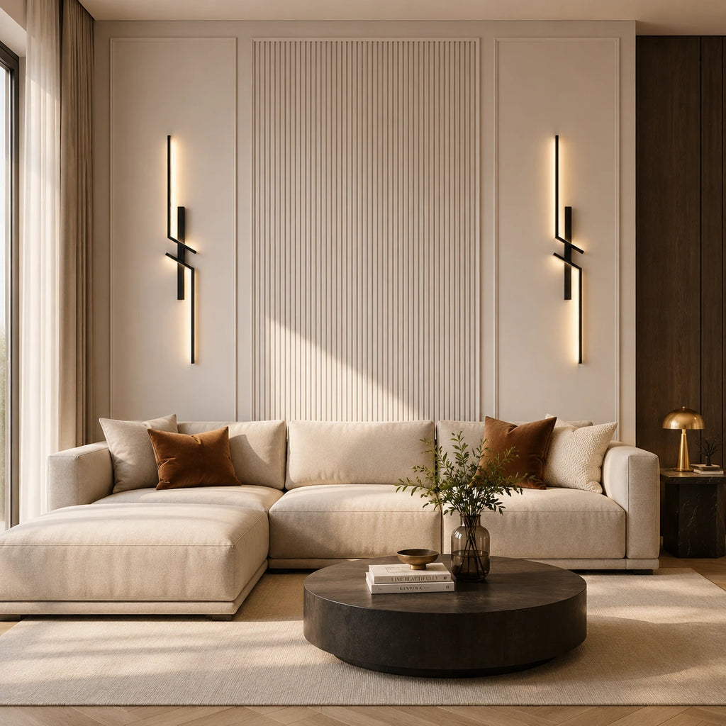 Black geometric two-bar LED wall lights beside a sectional sofa in a modern living room with fluted wall panel