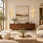 Gold double bar modern rechargeable LED wall light mounted in a living room, adding warm ambient accent lighting throughout.