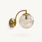 Gold Ribbed Glass Globe Nordic Wall Sconce in gold frame with amber ribbed glass globe shade