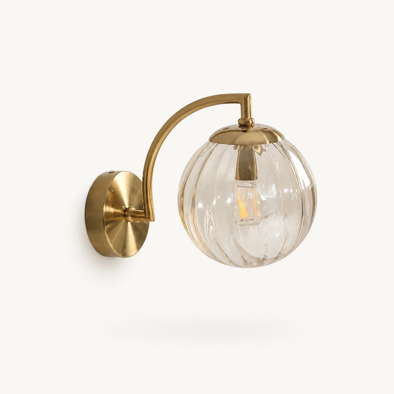 Gold Ribbed Glass Globe Nordic Wall Sconce in gold frame with amber ribbed glass globe shade