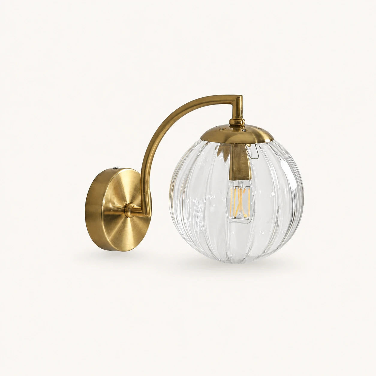 Gold Ribbed Glass Globe Nordic Wall Sconce in gold frame with clear ribbed glass globe shade