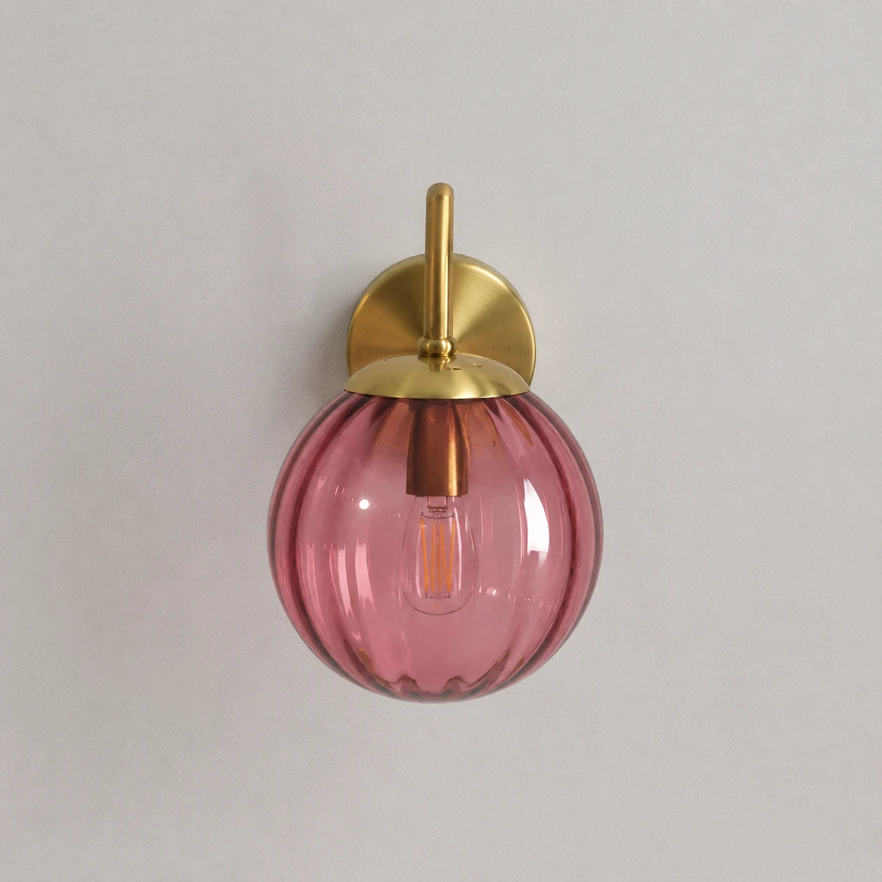 Gold Ribbed Glass Globe Nordic Wall Sconce front-facing view showing gold stem and ribbed glass globe