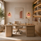 Gold Ribbed Glass Globe Nordic Wall Sconces in gold with rose red globe flanking a desk in a home office