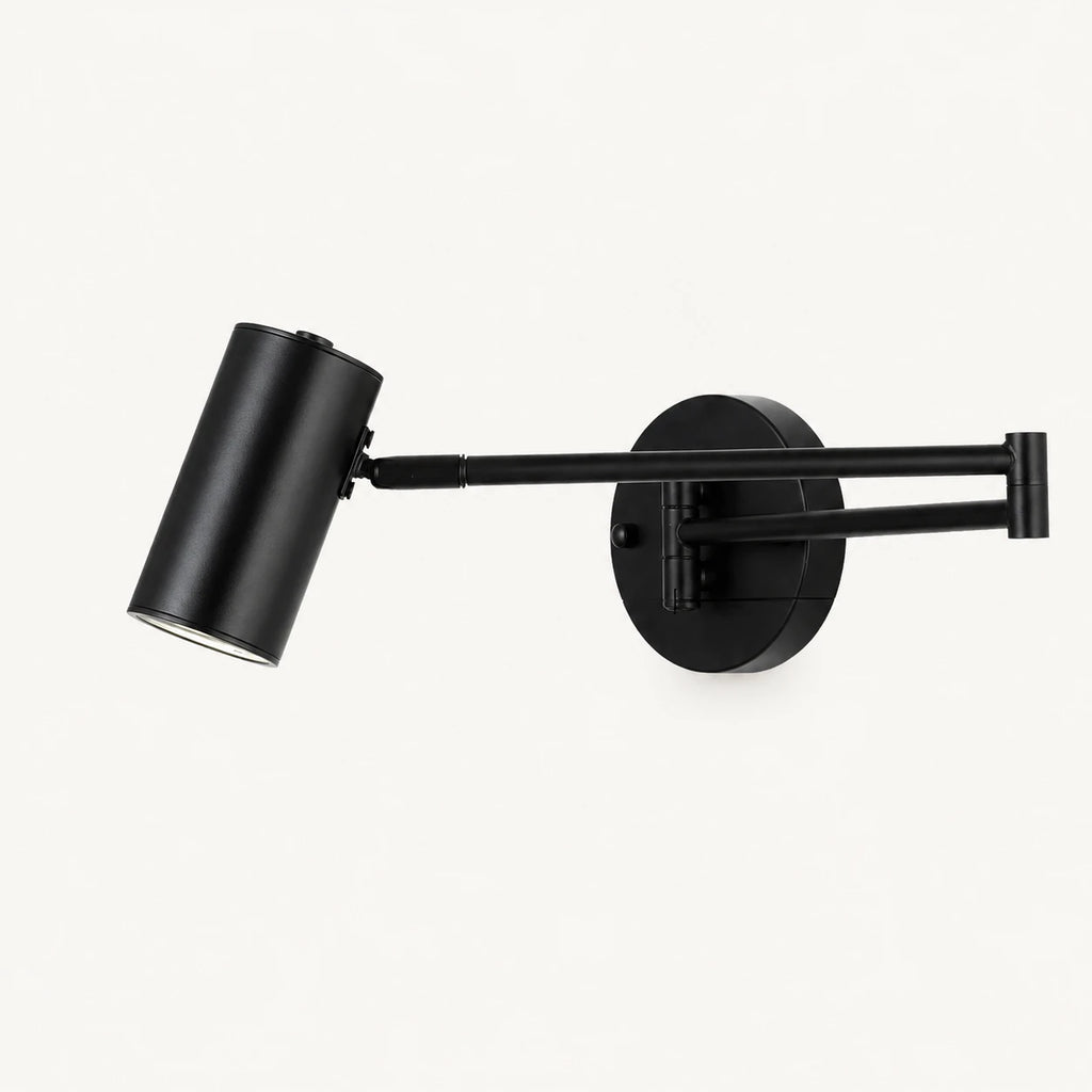Industrial swing arm LED wall light with black cylinder shade — matte black hardware and open cylinder shade product view.
